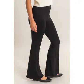 Side View Flare Black Pants with white shirt and black flats