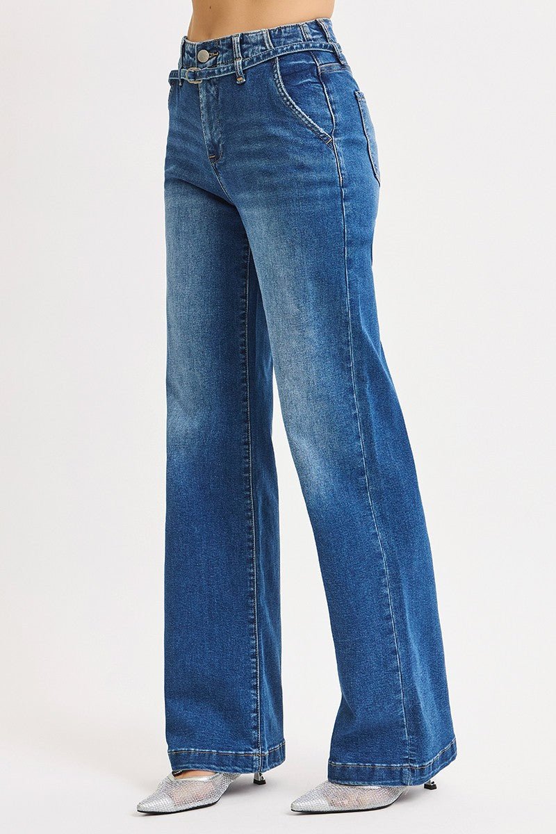 Blue jeans worn by a person on a white background