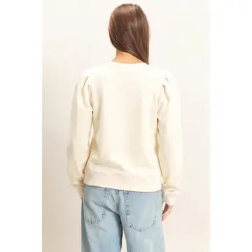 Back View of Cream Sweater with Jeans