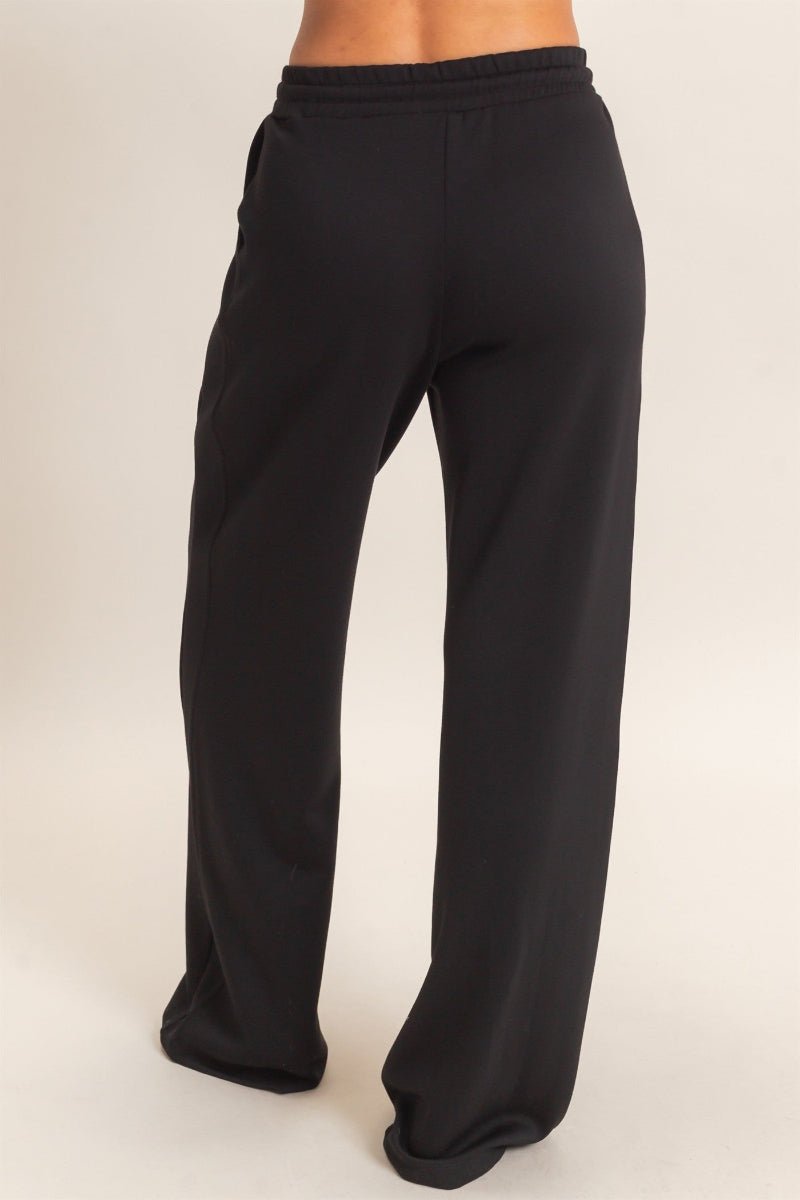 Black wide-leg pants on a white background