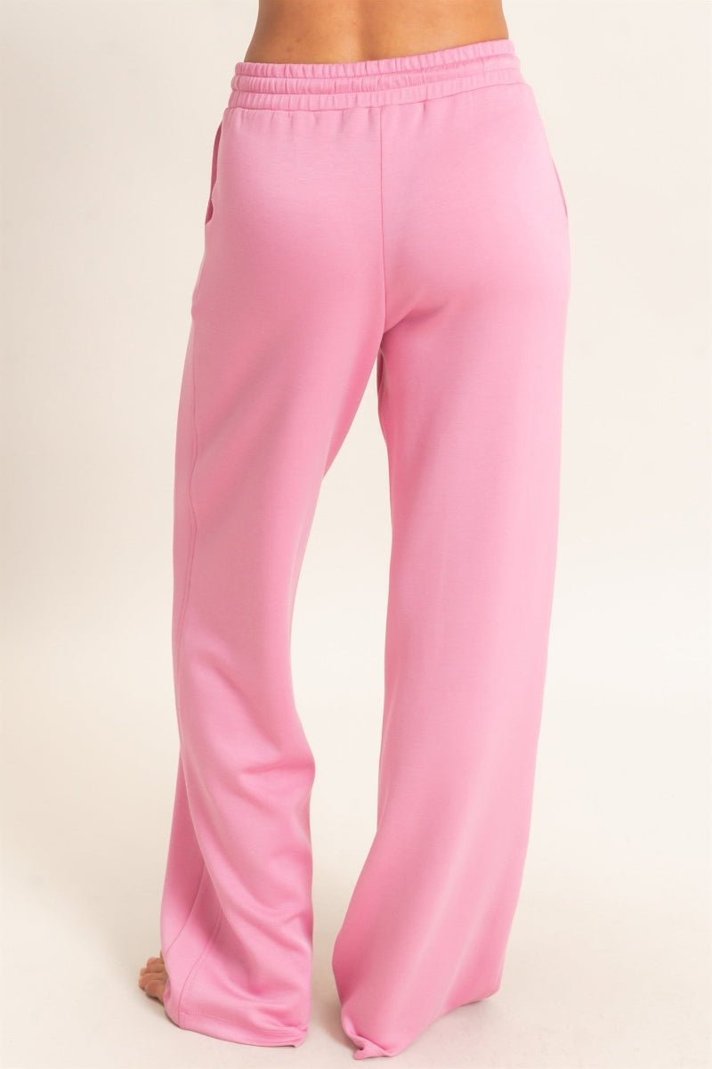 Pink pants on a beige background