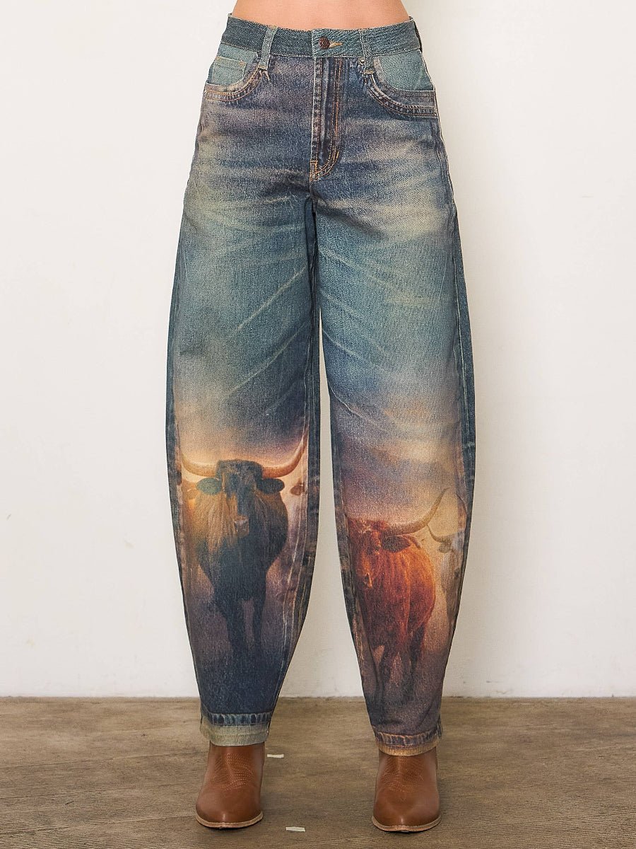 Denim jeans with a bull print on a plain background