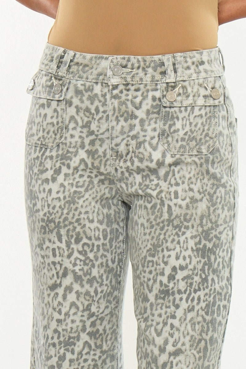Leopard print pants worn by a person on a white background