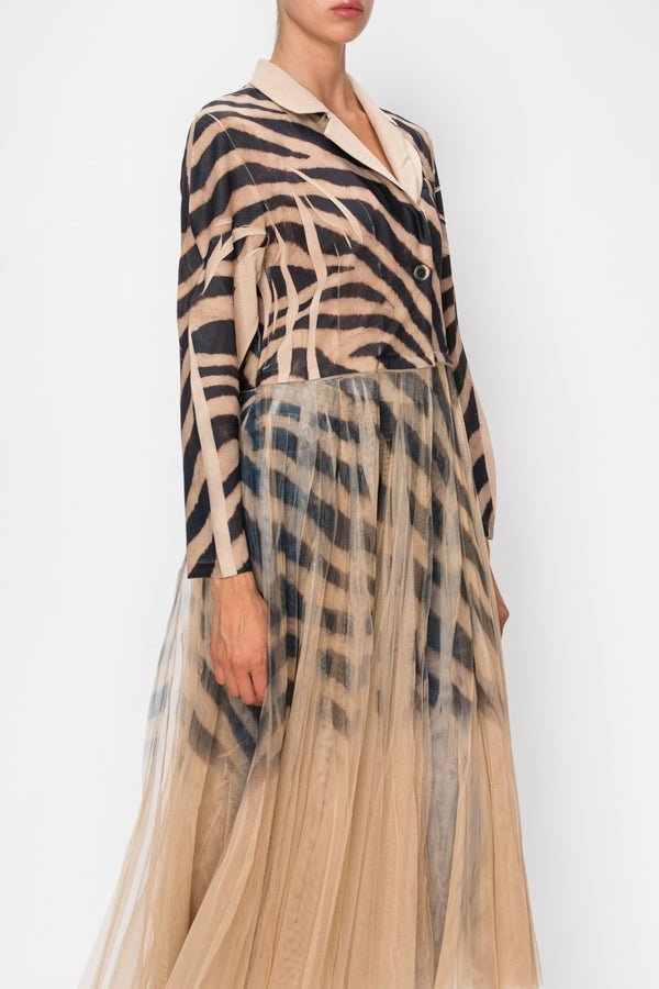 Woman wearing a black and tan zebra long cardigan jacket