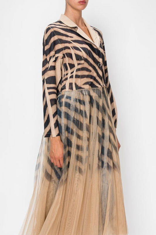 Woman wearing a black and tan zebra long cardigan jacket
