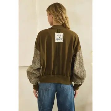 back of bomber jacket with  white label Love & Peace  
