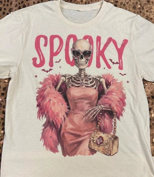 Natural Cotton T With Spooky Skeleton Graphic wearing a pink boa