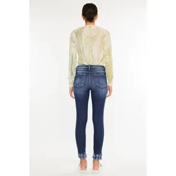 Women Facing Forward wearing jeans and a beige top