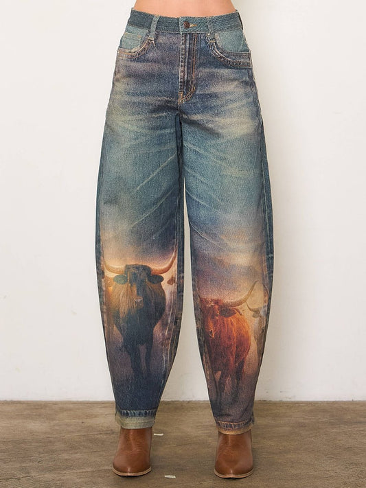 Denim jeans with a bull print on a plain background