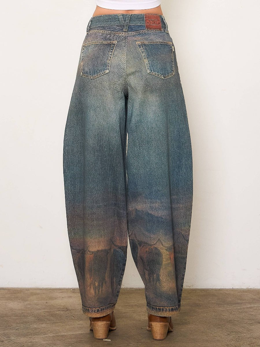Blue jeans worn by a person on a plain background