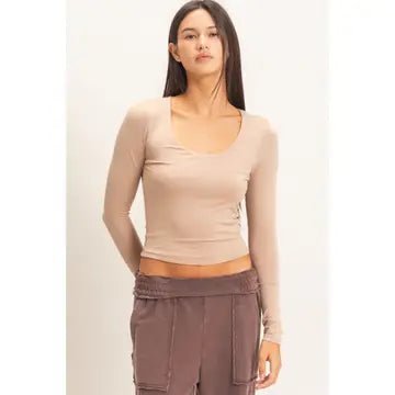 Women in Cream Shirt and Brown Pants